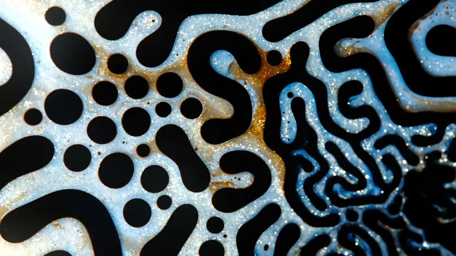 Abstract blue and gold organic patterns evoking brain networks and decision fatigue energy.