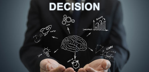 Open hands cupping a brain sketch surrounded by decision-making icons and the word decision.