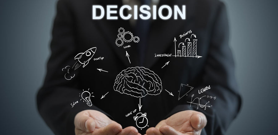 Open hands cupping a brain sketch surrounded by decision-making icons and the word decision.