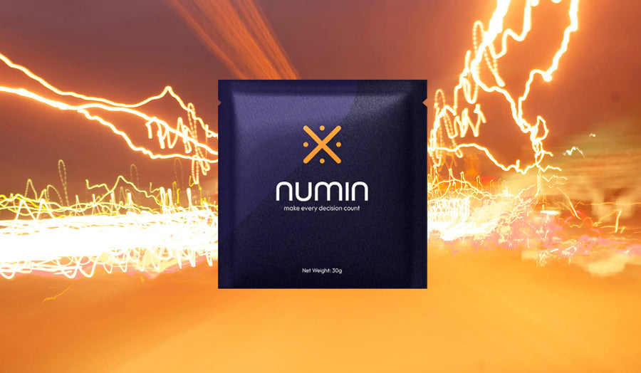 Brain health supplements Numin packet displayed against dynamic golden light trails symbolizing boosted focus and cognitive performance