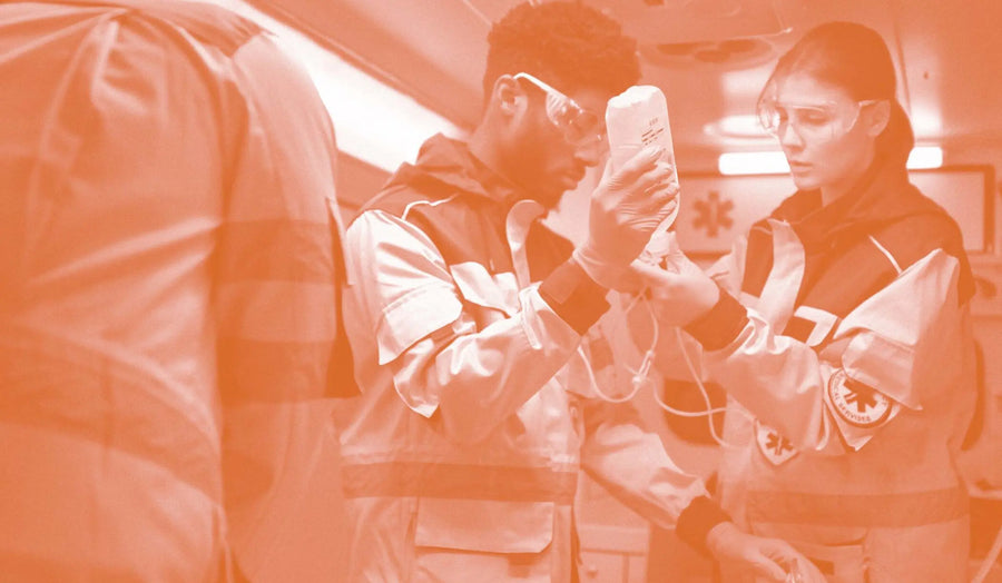 Brain supplements being administered by emergency medics inside an ambulance setting.
