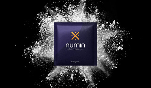 Cognitive booster supplement Numin packet displayed against an explosive white powder background symbolizing mental clarity and energy