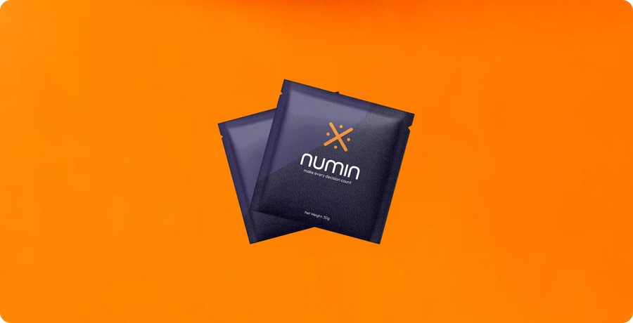 rain boosters sachets from Numin displayed on a vibrant orange background for enhanced mental clarity and focus.