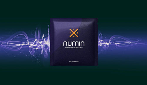 Productivity beverage Numin energy drink sachet with glowing wave design on a dark background.