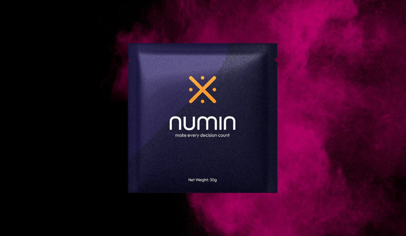 Supplements for mental alertness Numin packet displayed against a vibrant magenta powder background symbolizing focus and cognitive energy