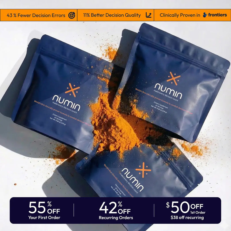 Three blue Numin brain supplement powder pouches with orange turmeric spilling out on white surface
