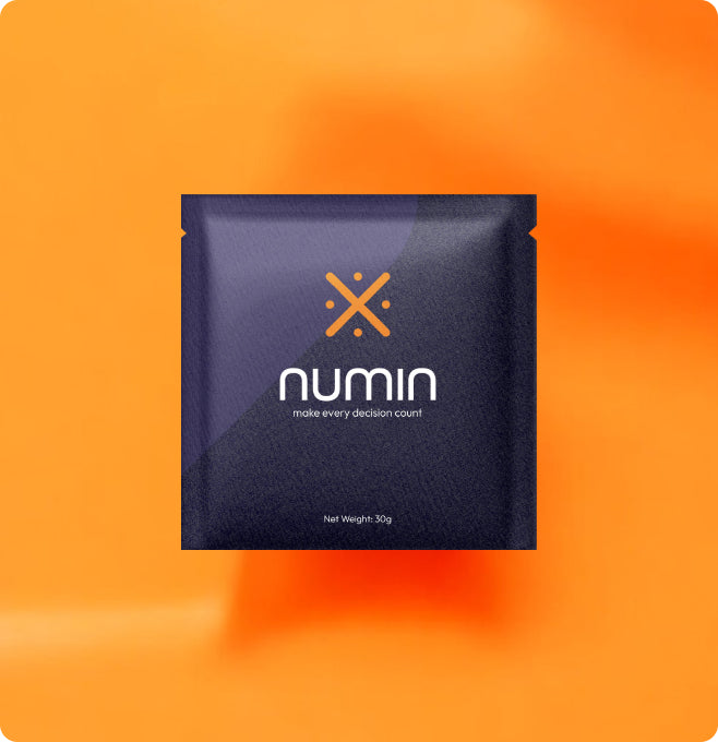 Numin nootropic supplement packet in dark blue packaging on orange gradient background