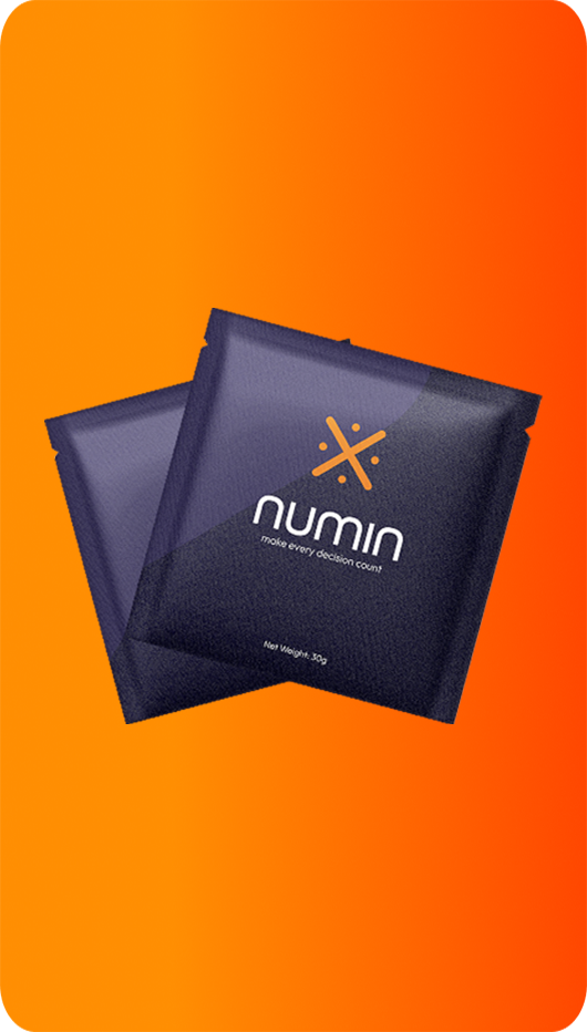 Two Numin nootropic supplement packets on orange background for decision fatigue and mental clarity